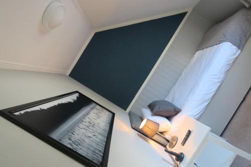 an overhead view of a small room with a bed and a table at Ben Loyal Hotel in Tongue