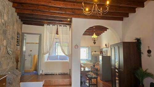 a room with a bedroom with a bed in it at Persephone's Home in Skala