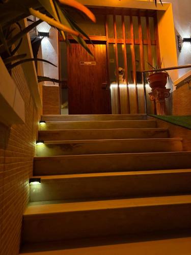 a set of stairs in front of a door at Possidon in Agia Marina Aegina
