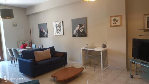 a living room with a couch and a table at Residence Villa Savoia in Marino