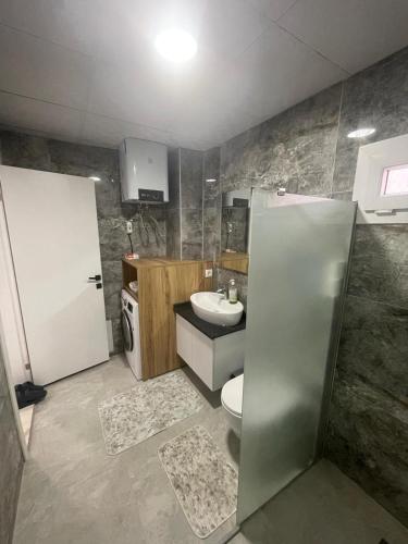 a bathroom with a toilet and a sink at AC Konaklama in Kuşadası