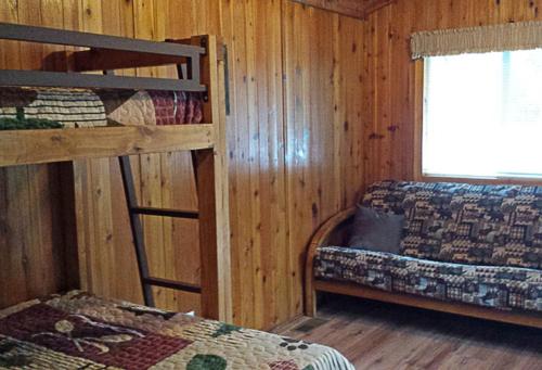 a bedroom with two bunk beds and a window at Mount Vernon Camping Resort Studio Cabin 5 in Bow