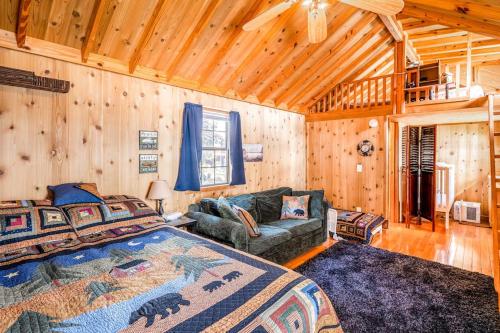 a bedroom with a bed and a couch in a room at Echo Lake Family Fun in Bigfork
