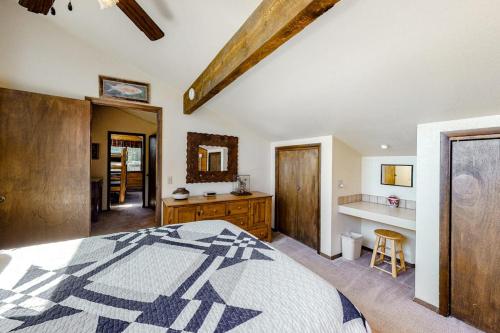 a bedroom with a bed and a desk in it at The Norma Charles in South Fork