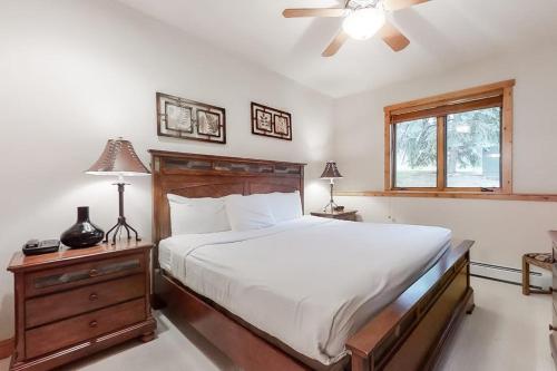 a bedroom with a bed and a ceiling fan at Waterstone 2748 in Steamboat Springs