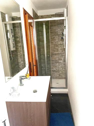 a bathroom with a sink and a shower at Il Sogno di Giorgio in Chiavari