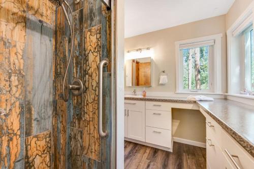 a kitchen with a large wooden door in a room at Misty Meadow in Fraser