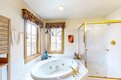 a large bathroom with a tub and a shower at Ski Den #22 in Copper Mountain