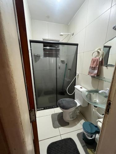 a bathroom with a shower and a toilet and a sink at Casa completa Janga in Paulista