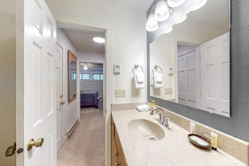a bathroom with a sink and a mirror at Ponderosa 2A Permit #3,01630 in Crested Butte