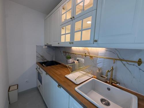 a kitchen with a sink and a counter at Apartments Marina in Sukošan