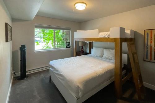 a bedroom with a bunk bed and a window at First Tracks 4105 in Steamboat Springs