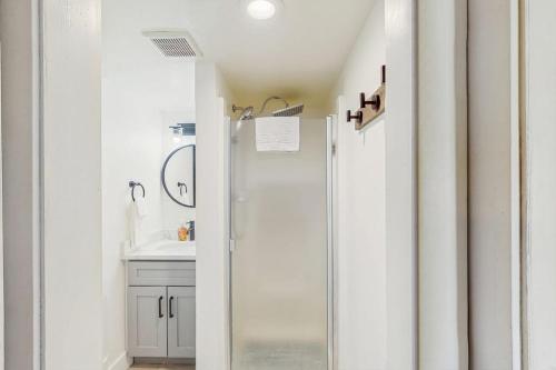 a bathroom with a shower and a sink at Winter Park Lodge II #104 in Fraser