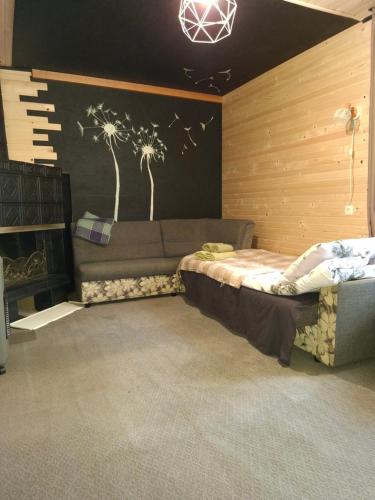a room with a bed and a couch in it at evkalipt in Ivano-Frankivsk