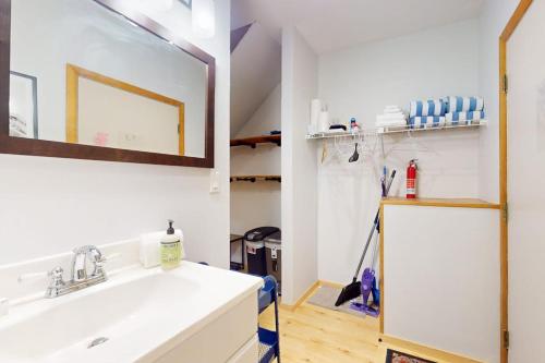 a bathroom with a sink and a mirror at SlopeSide Escape in Newry