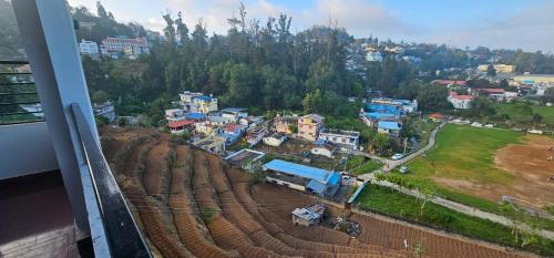 an aerial view of a small town with houses at hotel ruby international in Kodaikānāl