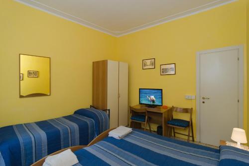 Giường trong phòng chung tại Il Ponte Affittacamere
