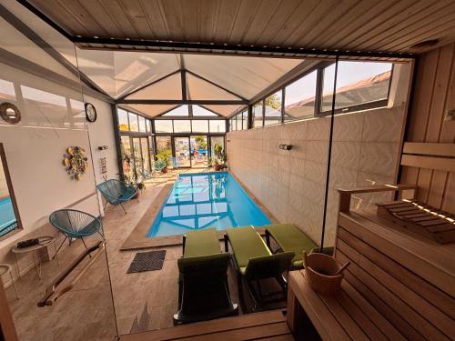 an overhead view of a swimming pool in a house at Laguna Boutique Hotel Bazaleti Lake in Dushetʼi
