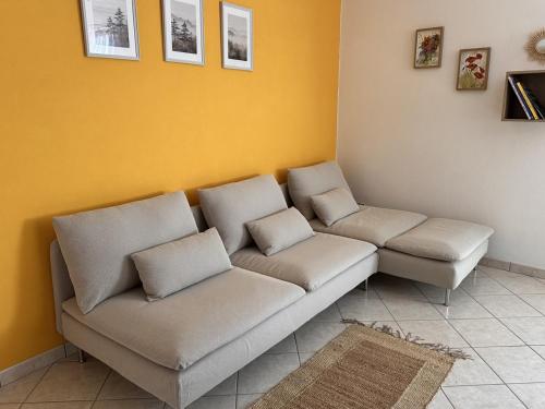 a living room with a couch and two chairs at Maison Josephine in Chiusa di Pesio