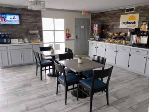 a dining room with tables and chairs in a restaurant at Days Inn by Wyndham Donalsonville in Donalsonville