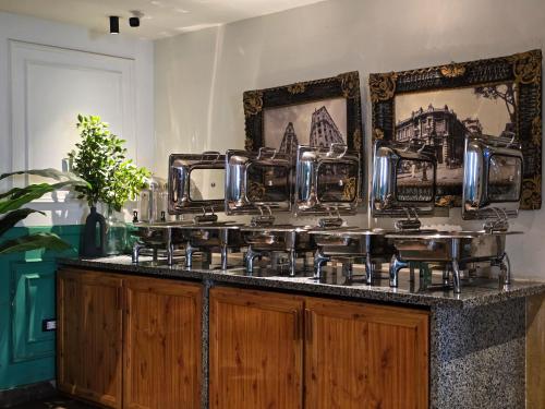 a counter with pots and pans on top of it at Panorama Ramsis Hotel & Cafe in Cairo