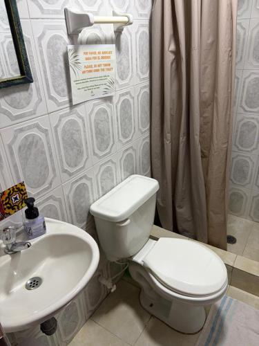 a bathroom with a toilet and a sink at Playa Zen Rodadero in Rodadero