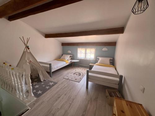 a kids room with two beds and a staircase at La Maison d'Orange - Au calme à 2 pas du Théâtre Antique in Orange