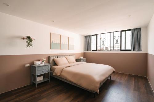 a bedroom with a large bed and a window at Morden Apt 6Br Old Quater in Hanoi