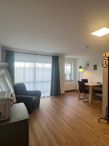 a living room with a couch and a table at Apartment Sebald in Ingolstadt