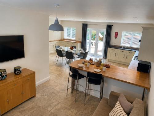a kitchen and living room with a table and chairs at Number 15 in Norwich