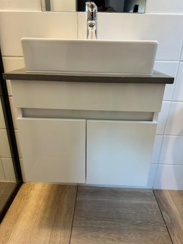 a bathroom with a sink and a counter at Midrand Stylish 1Bedroom Escape in Midrand