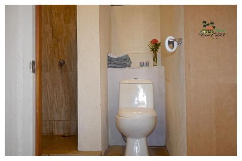 a bathroom with a white toilet in a room at Island View Estate in Kingstown