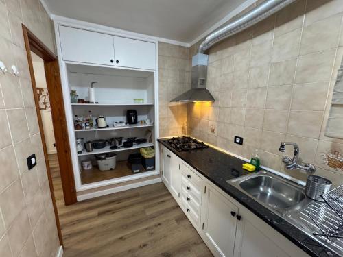 a kitchen with a sink and a counter top at Casa Rosales in La Orotava