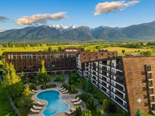 an aerial view of a hotel with mountains in the background at Edelweiss Studio - Aspen Valley in Razlog