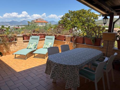 a table and chairs sitting on a patio at Casa Noemi in Sperlonga