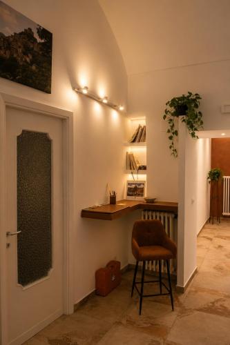 a hallway with a bar and a stool in a room at Residenza IL COLLE in Subiaco