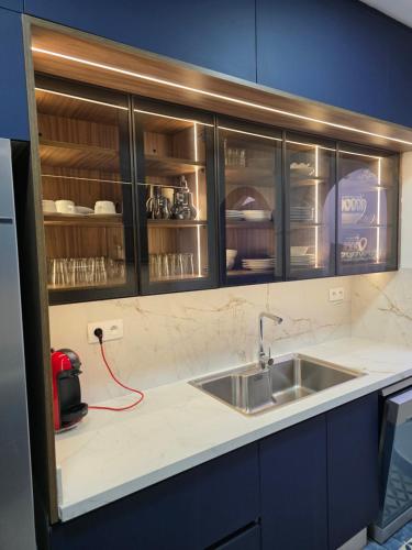 a kitchen with a sink and a counter top at Private villa with pool in Bouznika