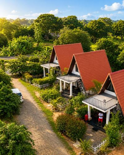 an overhead view of a row of cottages with red roofs at Pahana village Sigiriya in Sigiriya