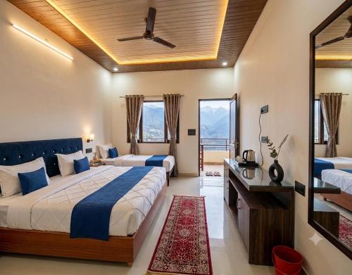a hotel room with a bed and a balcony at The Chapter Stay - Kedarnath in Phata