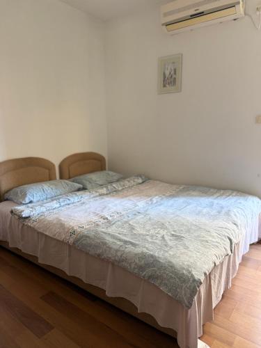 a bedroom with a bed in a room at Splendid corner in Bečići