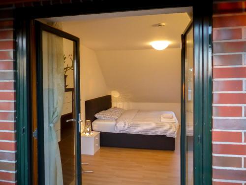 Postel nebo postele na pokoji v ubytování Appartement an der Seefelder Mühle