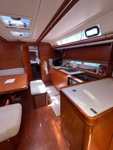 a kitchen and dining area of a boat at BeliBoat in Cascais