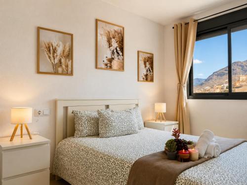 a bedroom with two beds and a window at Horizon Santa Monica in Aguadulce