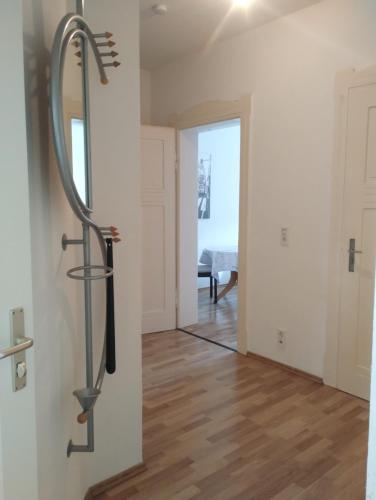 a large sword hanging on a wall in a room at Apartment Zur Bauhütte, WLAN in Hohenstein-Ernstthal