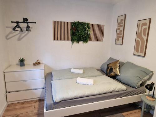 a couch with two pillows on it in a room at Grimm Apartment 4 in Kassel
