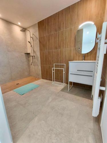 a bathroom with a sink and a mirror at Gîte de la Vonne in Vimines
