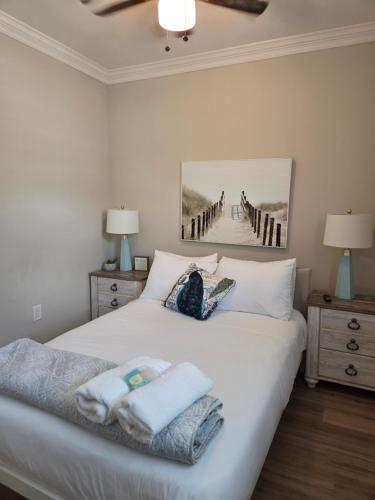 a bedroom with a bed with towels on it at Shore Getaway 2 in Atlantic City