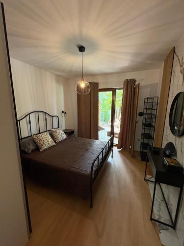 a bedroom with a large bed in a room at Apartmani Primorski kutak in Jadranovo