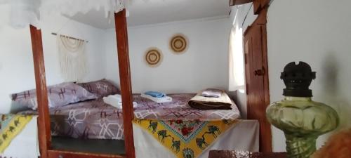 a bedroom with a bunk bed and a table in a room at Tinas House in Afiartis