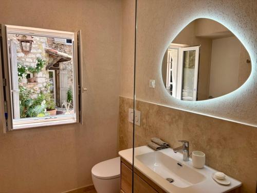 a bathroom with a sink and a mirror at La Petite Bergerie in Éze